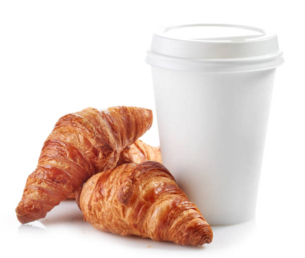 istock paper cup of coffee and croissants 674344478