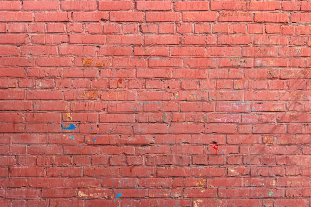 istock Red wall of painted brick 674349624
