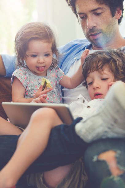 istock Father and children with digital tablet. 674352684