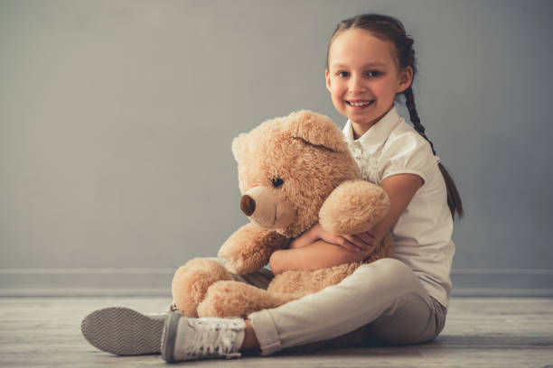 istock Little girl with toy 674358512
