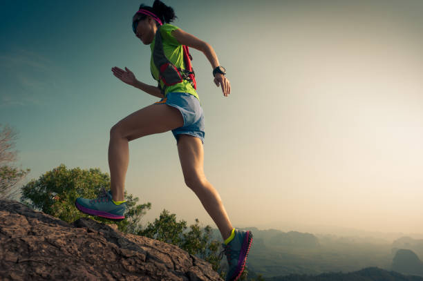 istock young woman trial runner running  up on mountain top 674362486