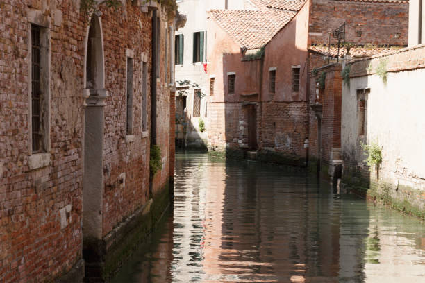 Waterways in Venice Venice a waterway in summer gebäude stock pictures, royalty-free photos & images