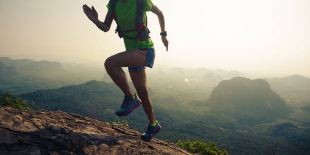 istock young woman trail runner running  up on mountain top 674370684