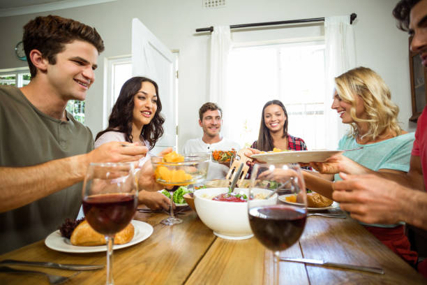 istock Happy friends having lunch at table 674371154