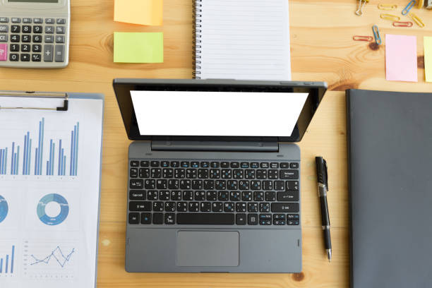 istock Wooden table with office supplies, top view 674377146