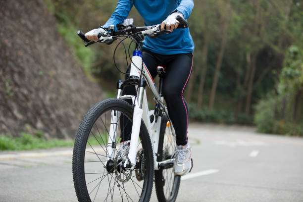istock cyclist cycling mountain bike on forest trail 674381126