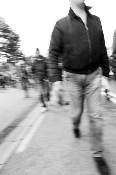 istock Dangerous group of people walking towards the camera eye. 674387574