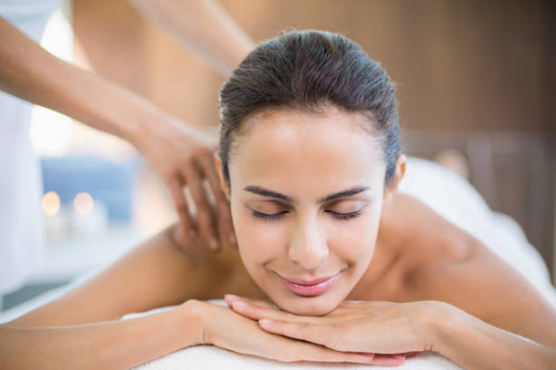 istock Beautiful woman enjoying massage 674388020