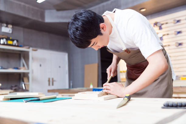 istock portrait of young man working in a carving workshop 674391100