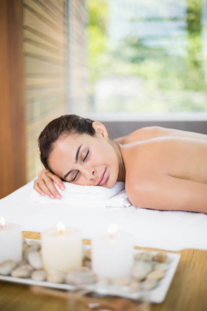 istock Woman relaxing on massage table 674393998