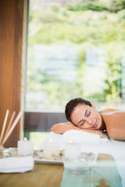 istock Woman relaxing during spa treatment 674394016
