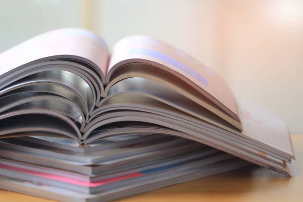 istock selective focus of the stacking magazine place on table. 674399934