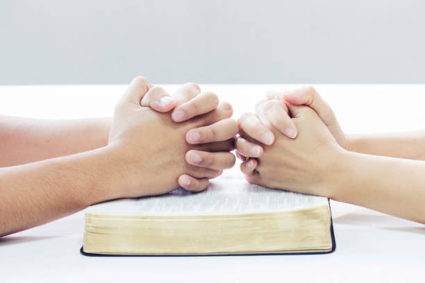 istock pray to God together 674400724