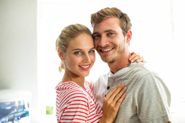 istock Portrait of smiling couple in kitchen 674403982