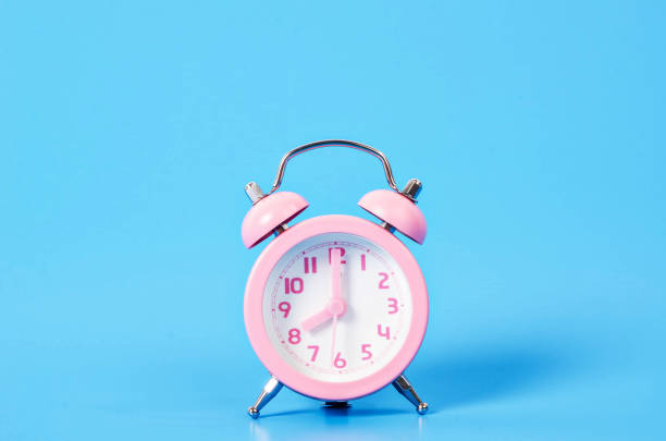 istock Vintage pink alarm clock 674404132
