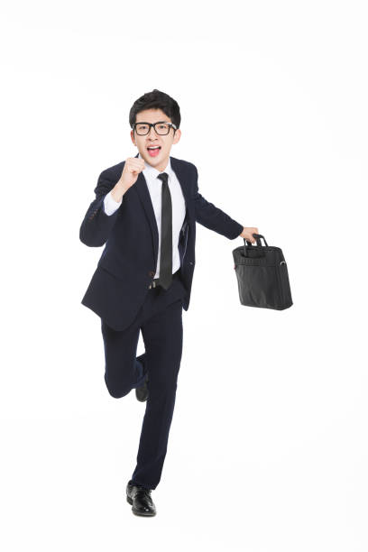 istock young businessman with a black bag running and screaming 674404240