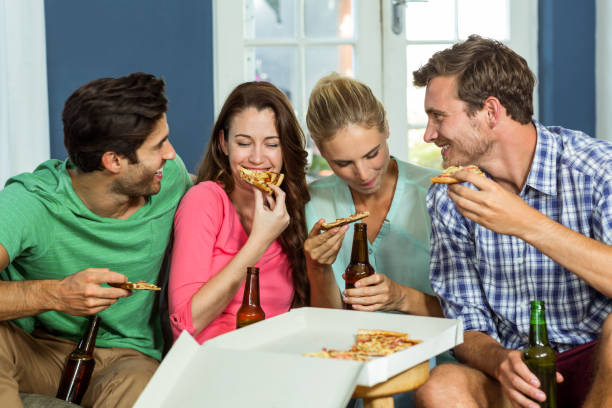 istock Smiling friends doing party at home 674410468