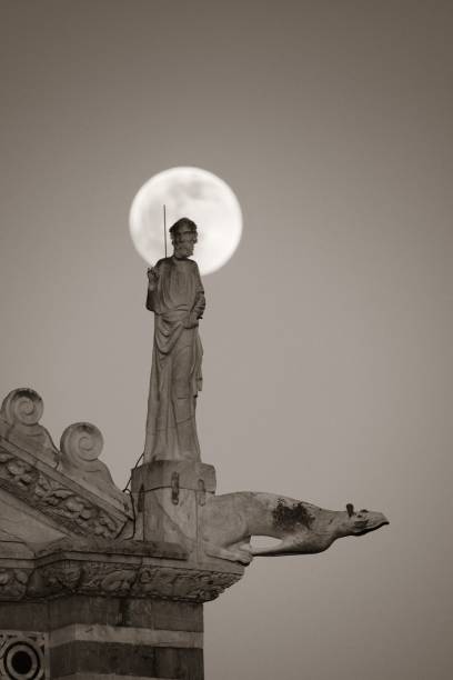 istock Moon and sculpture Pisa Italy 674410632