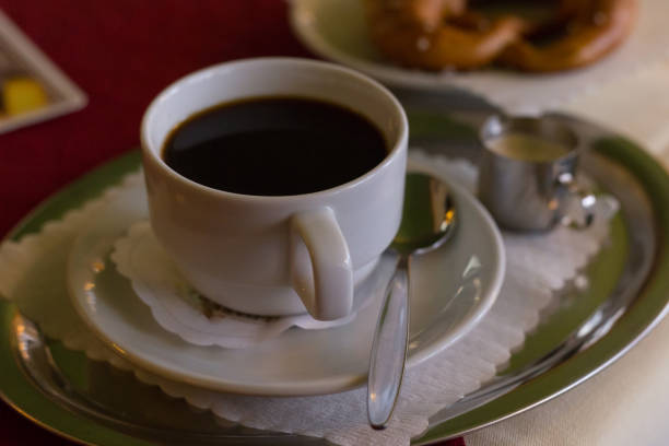 istock black coffe and pretzel from romantic cafe in south germany 674413358
