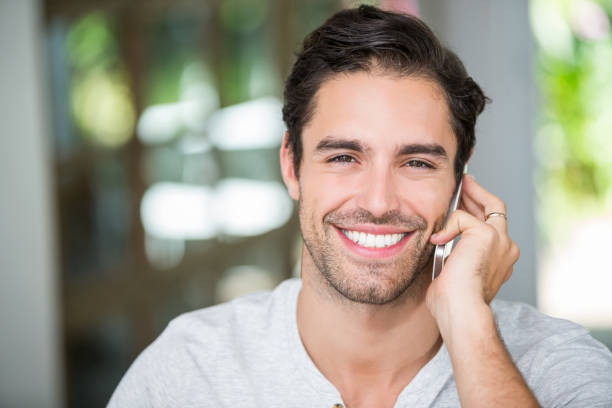 istock Portrait of man talking on smartphone 674417268