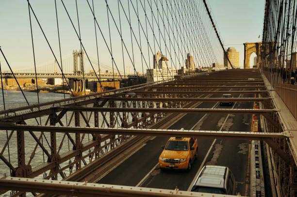 istock Brooklyn Bridge with traffic at sunset 674418220