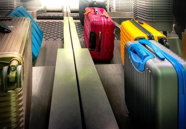 istock Colourful Suitcases  Are Loaded At Check-in Counter 674420948