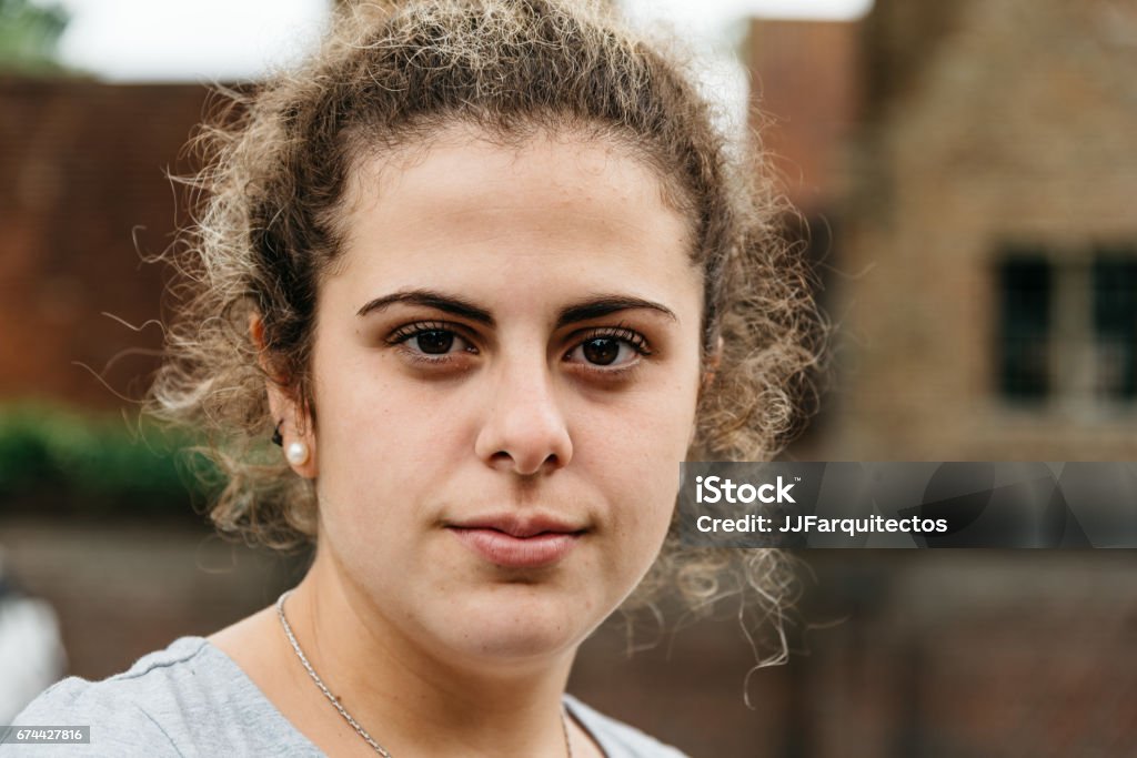 Headshot of young adult woman in the street with space for copy Millennial Generation Stock Photo