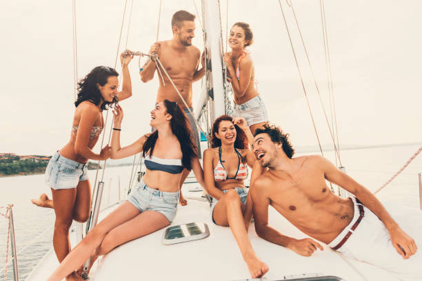 istock Happy friends on a yacht 674427902