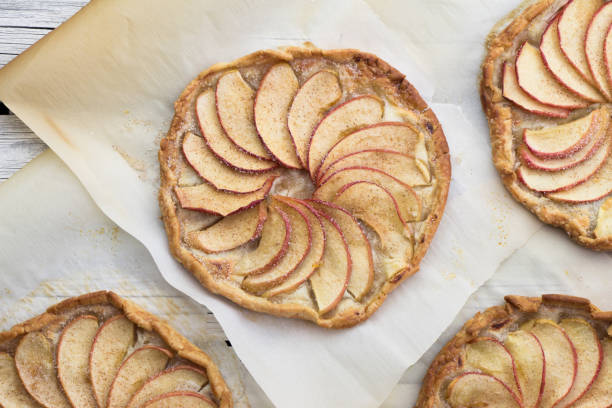 istock Apple pie on the thin crust with sugar and cinnamon. Apple tart with ricotta cheese and cinnamon. Apple's slices. Piece of pie. 674430674