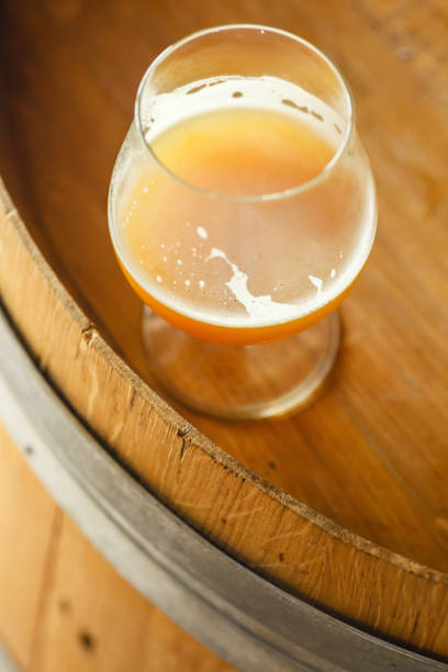 istock Wheat ale on a wooden barrel 674434656