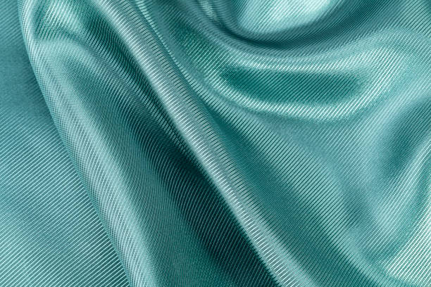 istock Silk background, texture of green ribbed  shiny fabric, close up 674441208