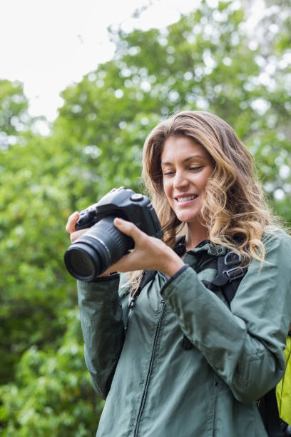 istock Low angle view of happy woman looking at camera 674441232