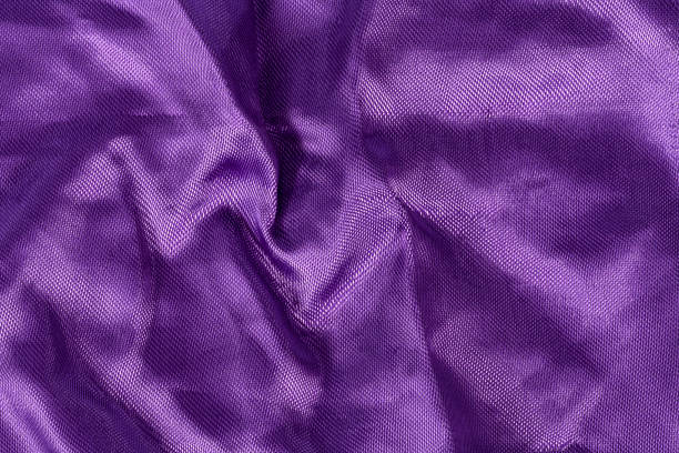 istock Silk background, texture of violet shiny fabric, close up 674441266