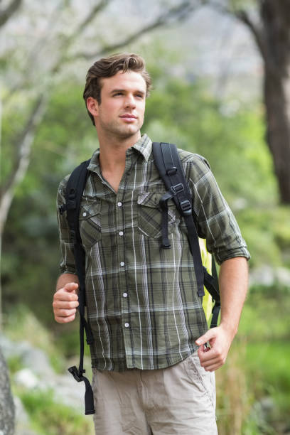 istock Young hiker looking away in forest 674447432