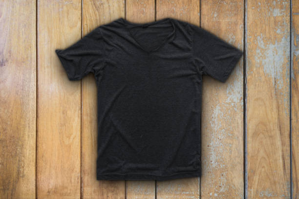 istock Grey t-shirt on wood background 674448072