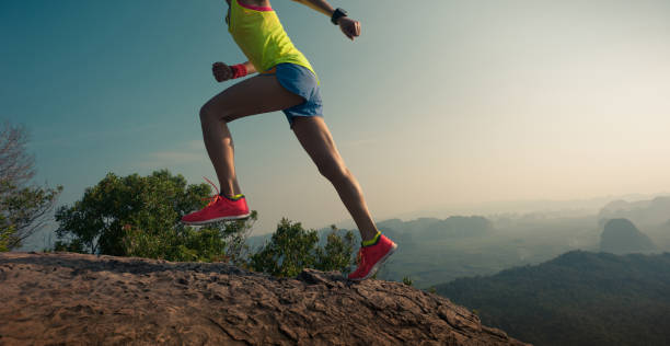 istock young woman trail runner running  up on mountain top 674453284