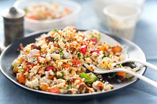 istock Cauliflower, quinoa & harissa spiced chickpeas with feta and mint dressing 674460124
