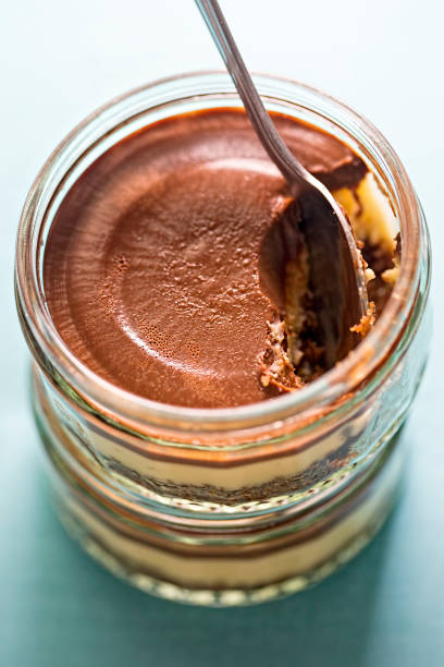 Two chocolate and vanilla cheesecake in the pot Two chocolate and vanilla cheesecake in the pot cake jar stock pictures, royalty-free photos & images