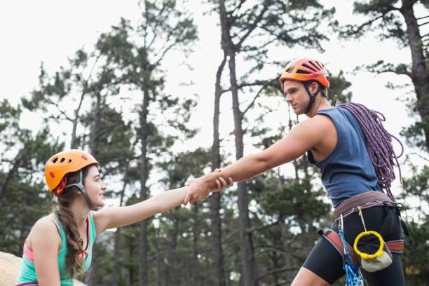 istock Young couple holding hands at forest 674469062