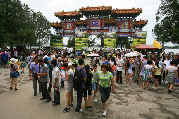 Beijing, China - June 26, 2011: visitors enjoying the Summer Palace Park in Beijing. The capital of China has over 20 parks, all of them very popular amongst locals and visitors alike. Many have palaces, shrines and lakes.