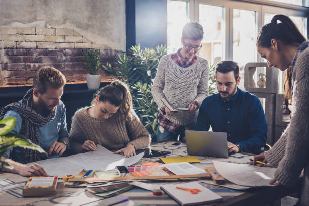 istock Team of young architects working at casual office. 674476560