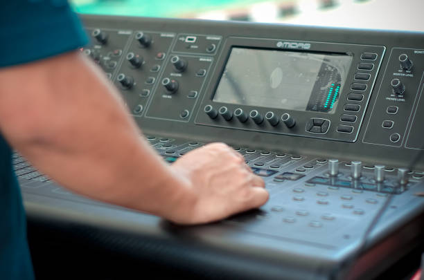 istock Hand Control of high-quality audio and equalizer volume on sound mixing console 674476628