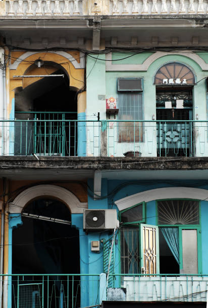 Close up of front of building at Cho Lon, amazing ancient architecture of old house at China town, Vietnam