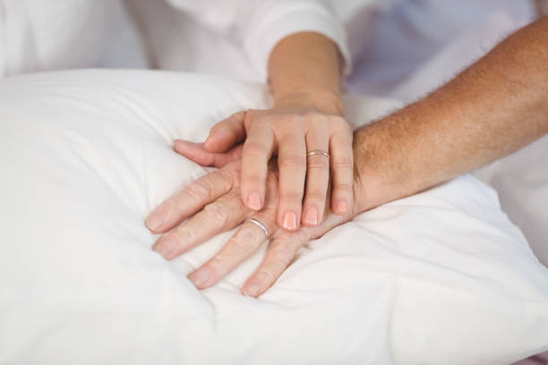 istock Senior couple holding hands 674490172