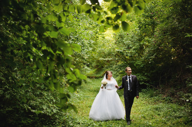 istock Wedding couple at green alley 674490306