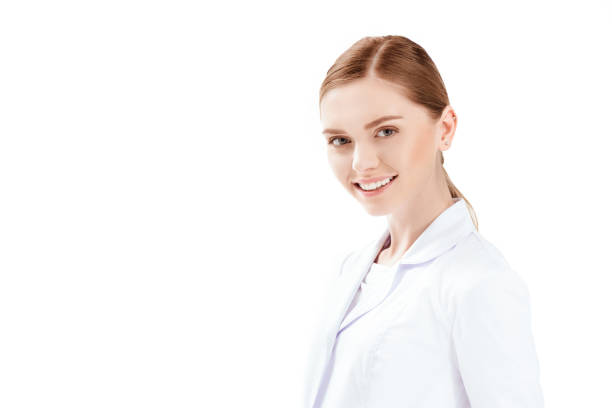 istock young attractive doctor in white coat smiling and looking at camera isolated on white 674497758