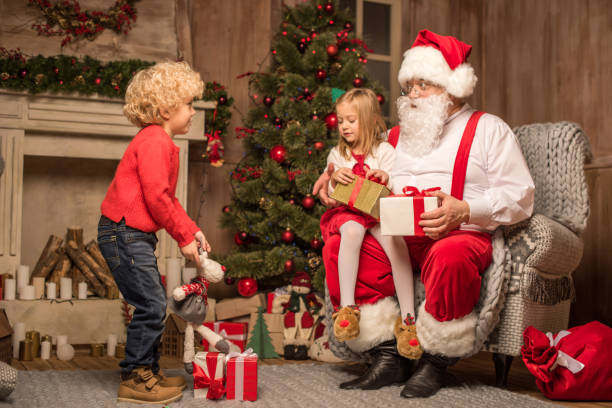 istock Santa Claus with happy children 674501564