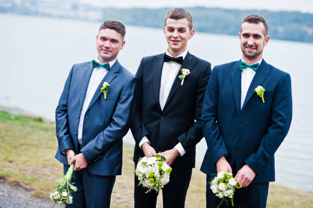 istock Three friends, groom with groomsman having fun, male potency theme 674501680