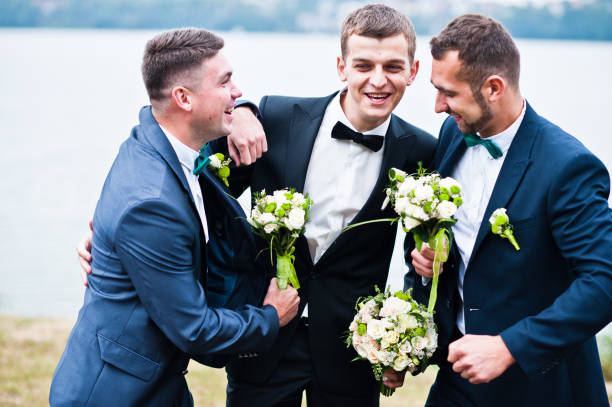 istock Three friends, groom with groomsman having fun 674501726