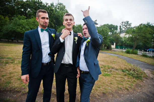 istock Three friends, groom with groomsman having fun 674501802